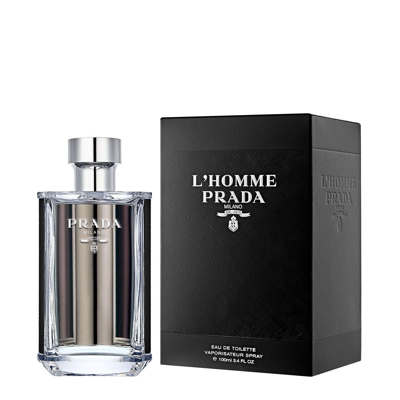 Prada L'Homme Eau de Toilette Flakon und Verpackung. Schwarze Verpackung mit Logo. Transparenter Flakon mit silbernem Verschluss.