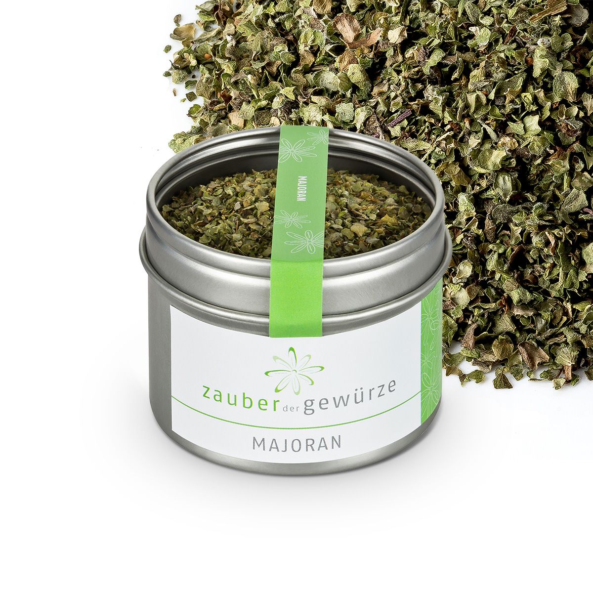 Dose mit Majoran, daneben Majoran-Haufen. Grün-weißes Etikett mit 'Zauber der Gewürze' und 'Majoran'. Grüner Streifen mit 'Majoran'.