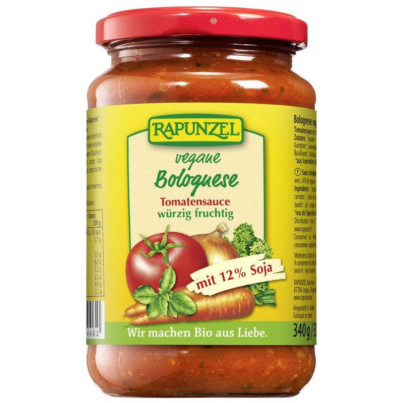 Glas mit Rapunzel vegane Bolognese Tomatensauce. Etikett mit Tomate, Zwiebel, Karotte und Schriftzug. Roter Deckel.