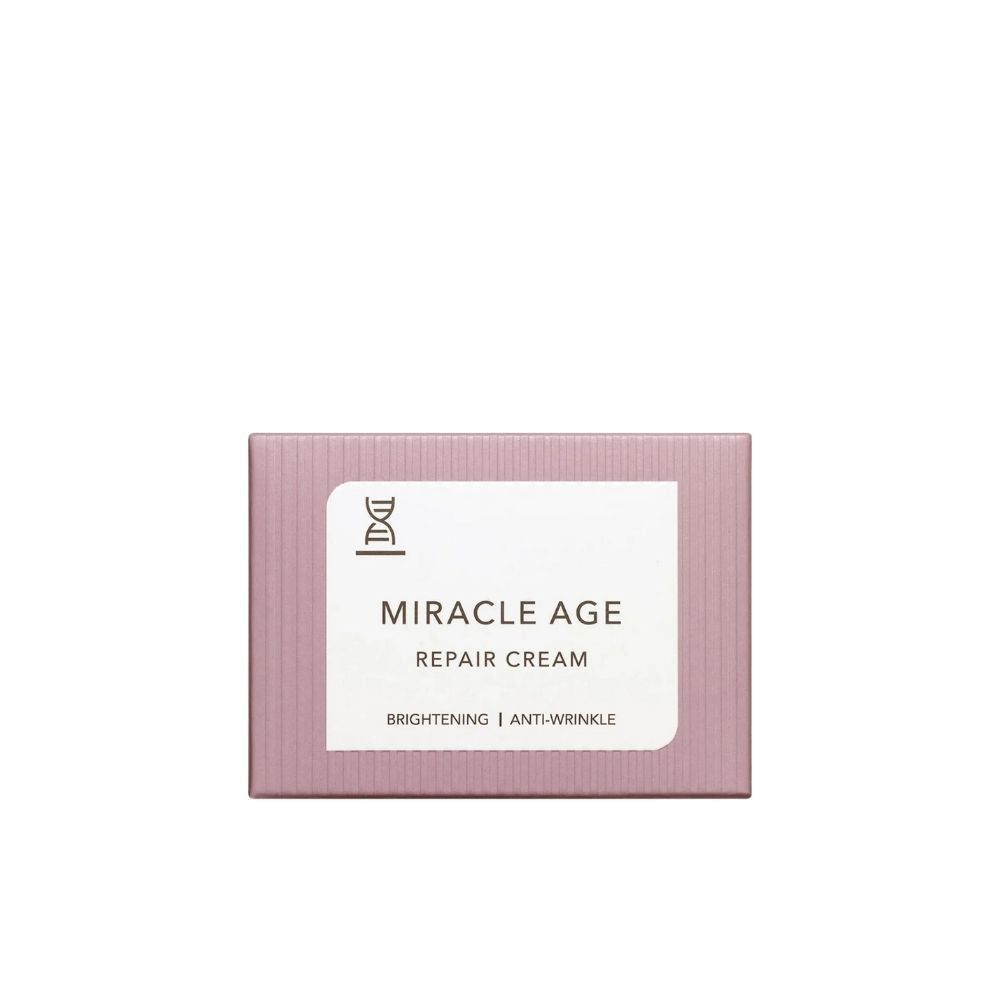 Rosa Schachtel mit weißem Etikett. Auf dem Etikett steht "MIRACLE AGE REPAIR CREAM". Darunter "BRIGHTENING | ANTI-WRINKLE".