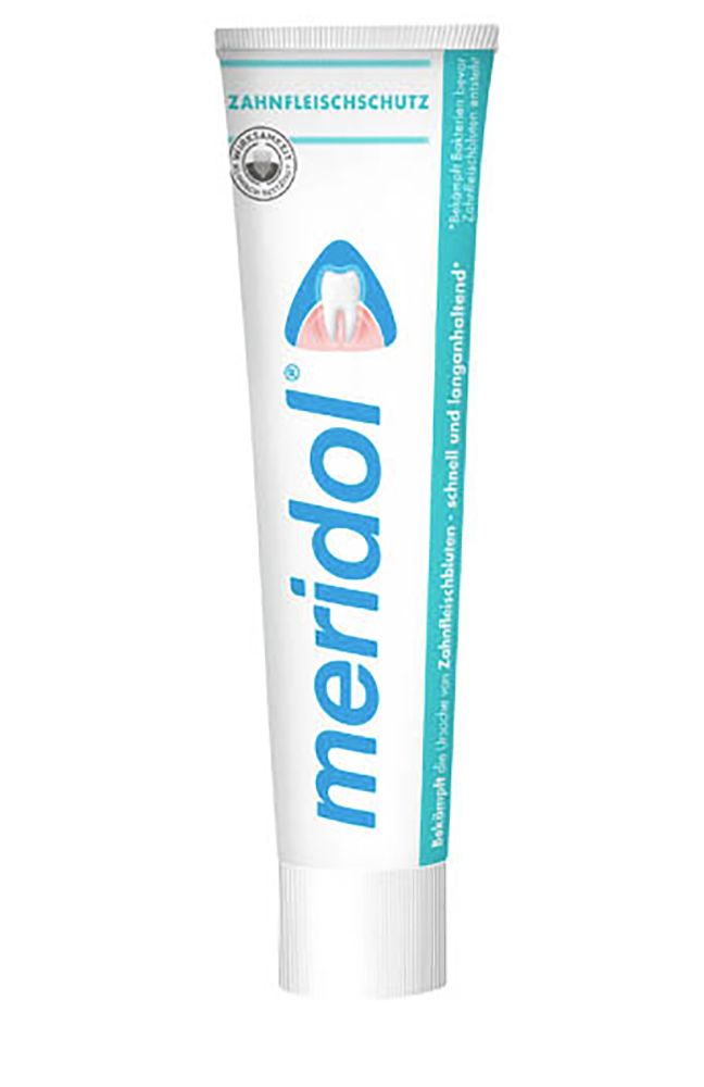 Zahnpasta-Tube mit blauem Schriftzug "meridol" und "Zahnfleischschutz". Logo mit Zahn und Zahnfleisch. Zertifizierungslogo.