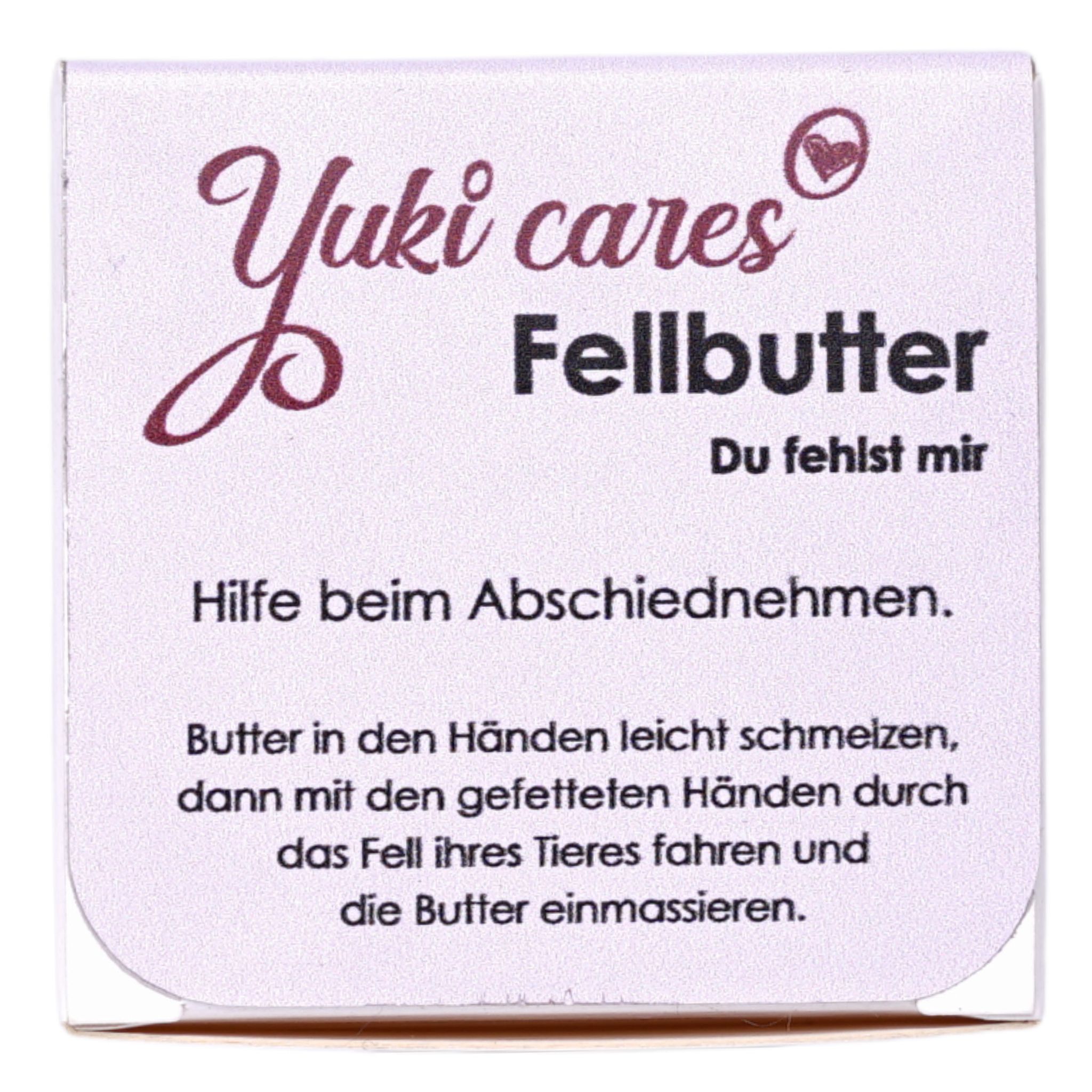 Quadratische Verpackung mit Produktnamen und Text. Schriftzug Yuki cares Fellbutter. Text: Hilfe beim Abschiednehmen.