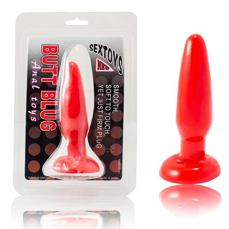 Roter Analplug in Blisterverpackung. Aufschrift: Butt Plug, Anal toys. Neben dem Plug: glatte Oberfläche, fester Griff.