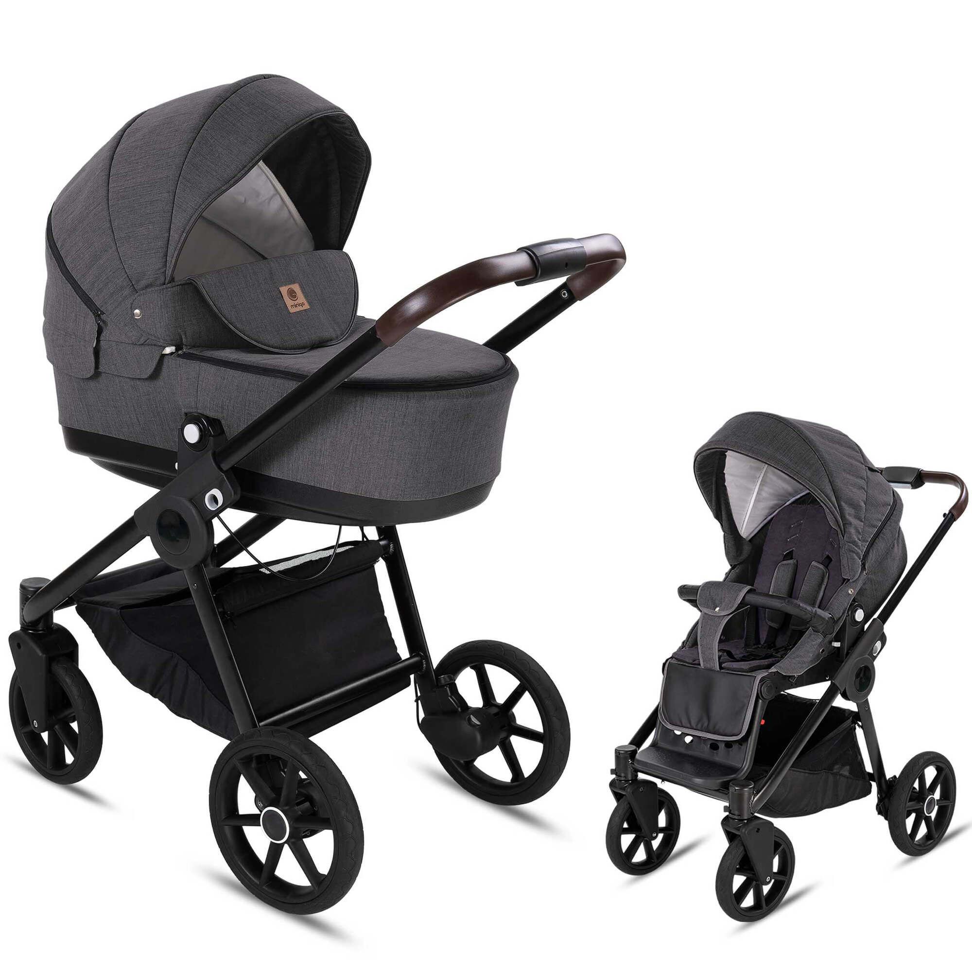 Kombikinderwagen Anthrazit, zwei Konfigurationen. Große Räder, schwarzes Gestell, brauner Griff. Babywanne und Sportsitz.