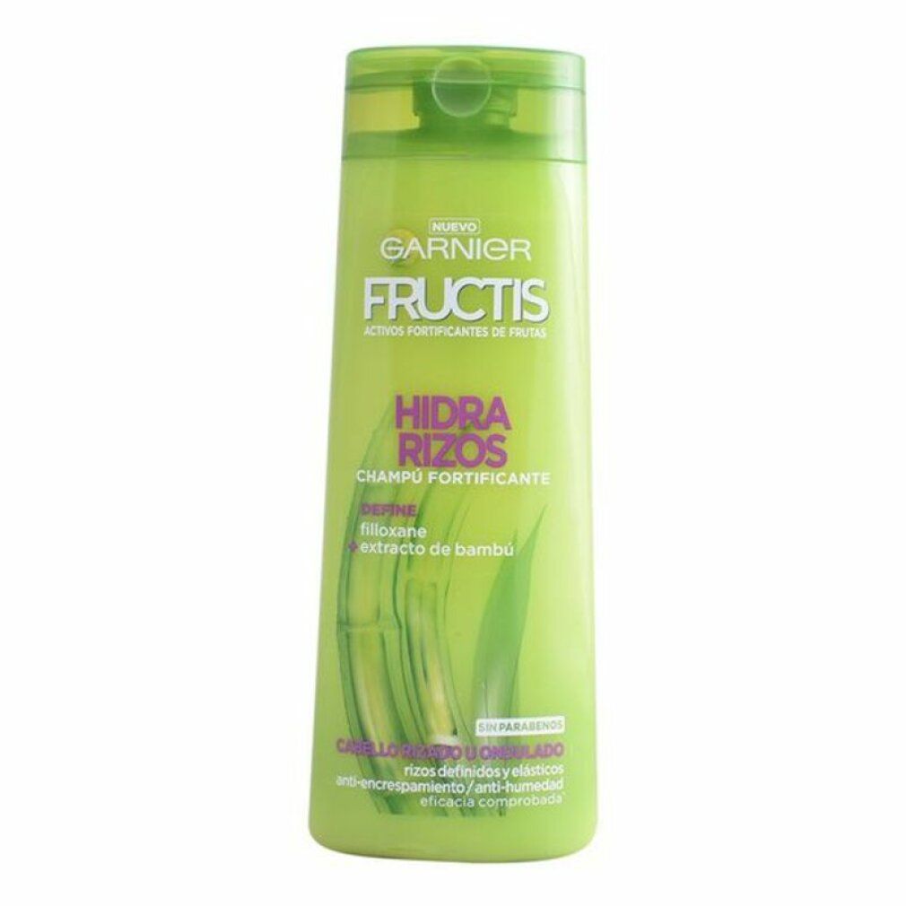 Grüne Shampoo-Flasche. Garnier Fructis Hidra Rizos. Text: Champú Fortificante. Mit Bambus-Extrakt. Für lockiges und welliges Haar.