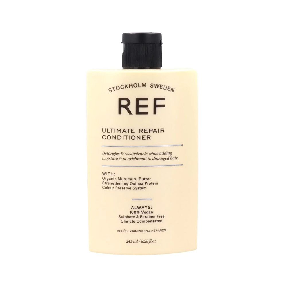 Beige Flasche mit schwarzem Deckel. Aufschrift: REF Ultimate Repair Conditioner. Enthält 245 ml.