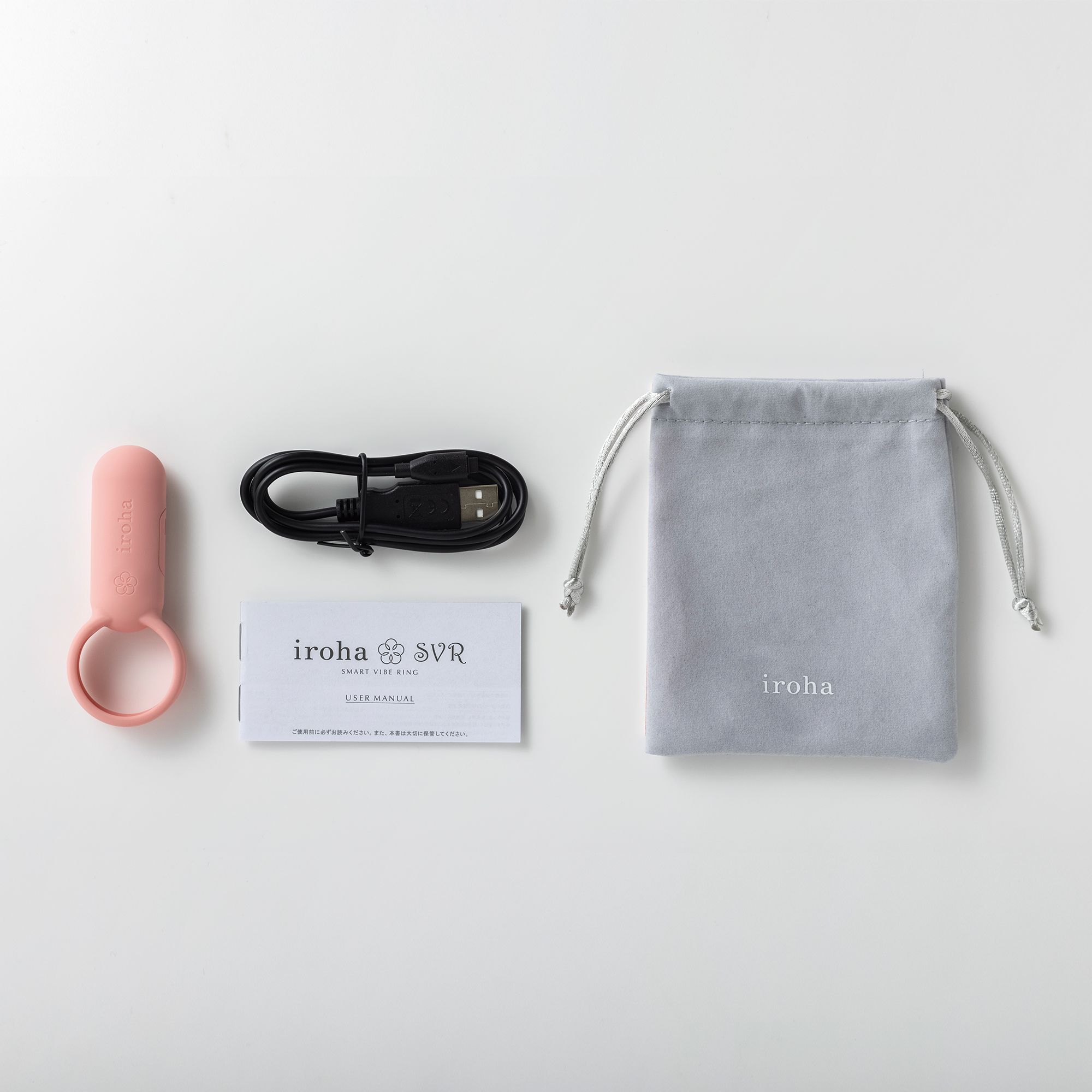 Paarvibrator, Ladekabel, Beutel und Anleitung. Marke iroha. Weißer Hintergrund.