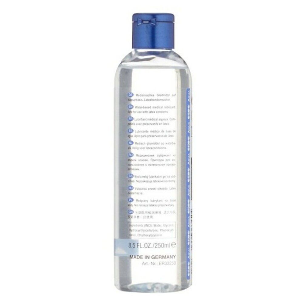 Rückseite einer klaren Flasche mit blauem Deckel. Etikett mit Text.