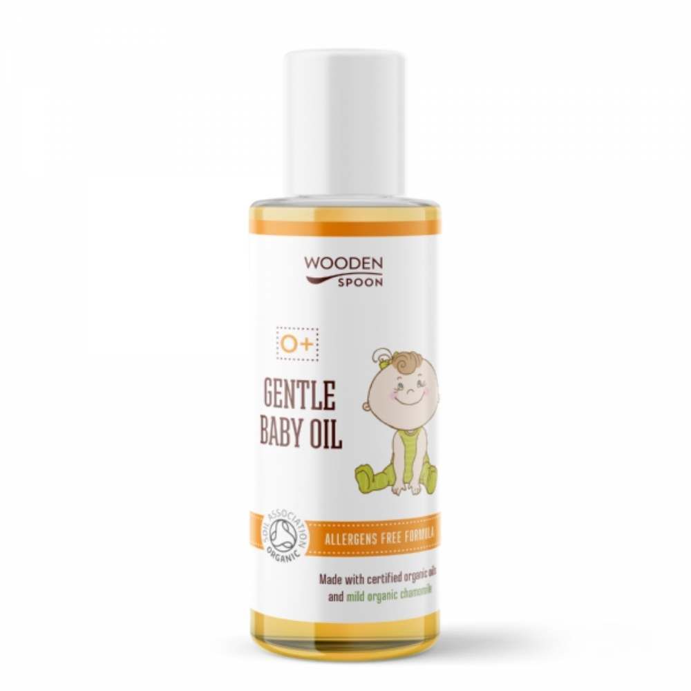 Babyöl-Flasche mit weißem Deckel und gelbem Etikett. Aufschrift: Gentle Baby Oil, Wooden Spoon, Cosmos Organic.