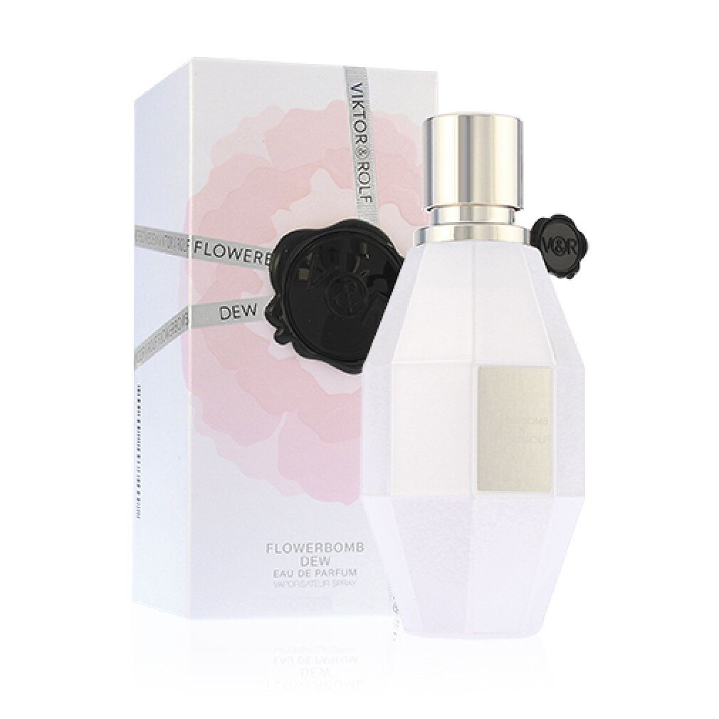 Parfümflasche und Schachtel. Flasche weiß, achteckig, mit silbernem Verschluss und schwarzem Verschluss. Schachtel weiß mit rosa Blüte und Text.