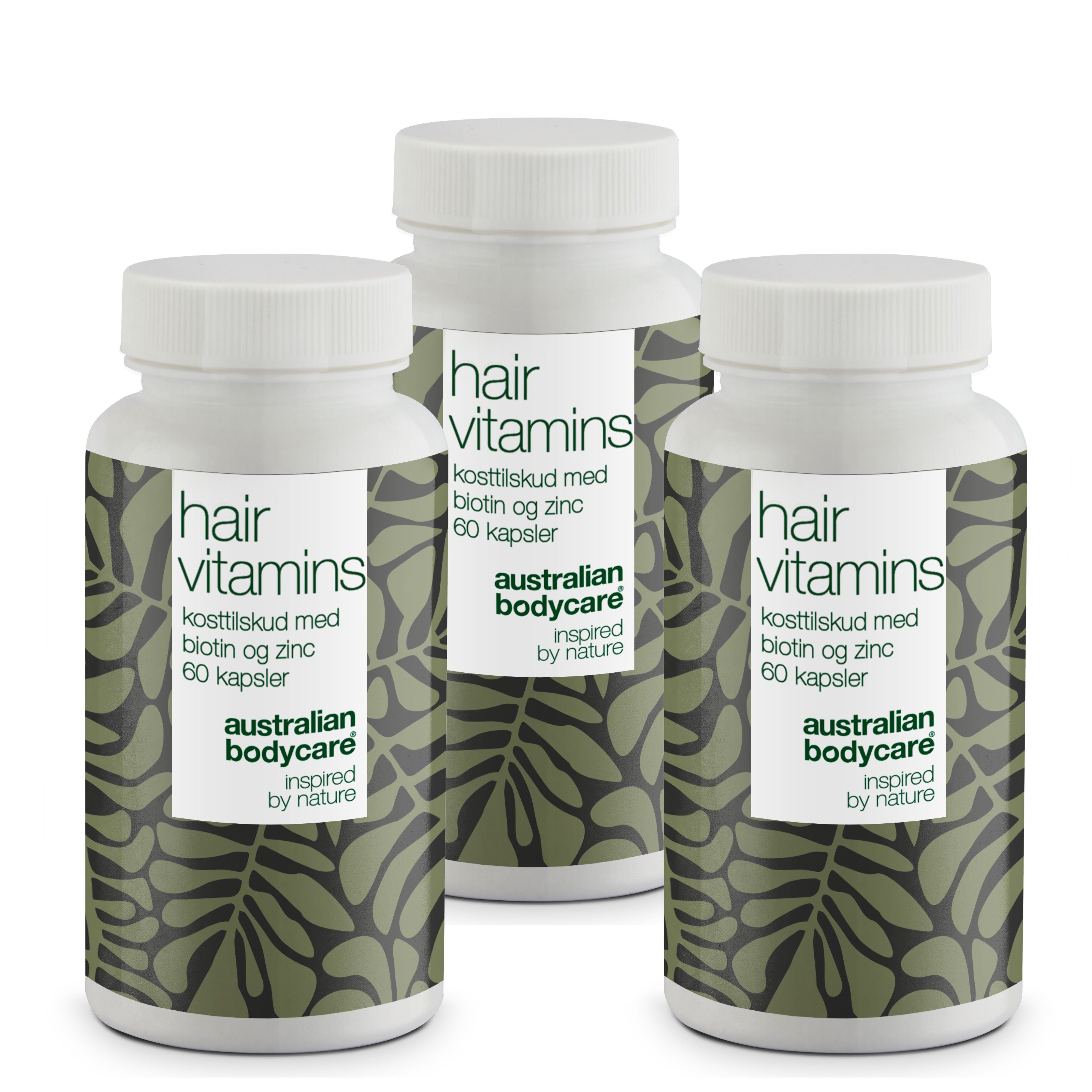Drei weiße Flaschen mit Etiketten. Aufschrift: Hair Vitamins, Biotin und Zink, 60 Kapseln. Marke: Australian Bodycare.