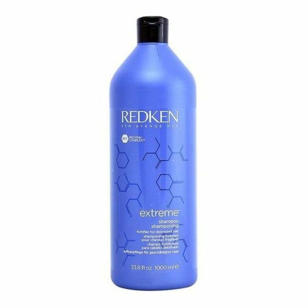 Große blaue Shampoo-Flasche mit schwarzem Deckel. Aufschrift: Redken, Extreme Shampoo. 33.8 fl oz.