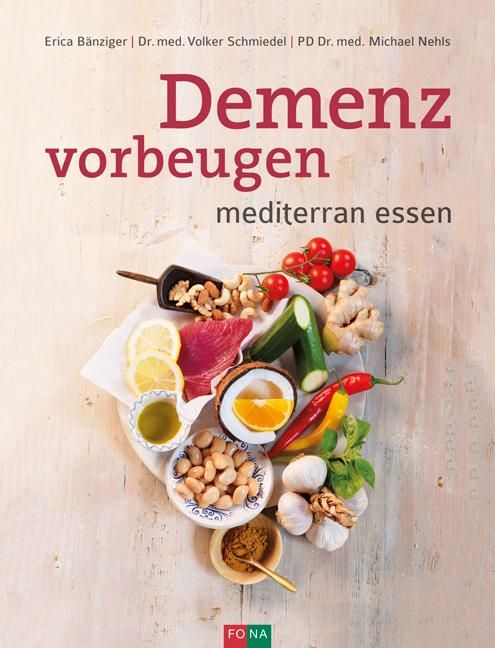 Buchcover mit Titel "Demenz vorbeugen". Darunter "mediterran essen". Auf hellem Holzbrett arrangierte Lebensmittel: Tomaten, Gemüse, Nüsse, Fisch.