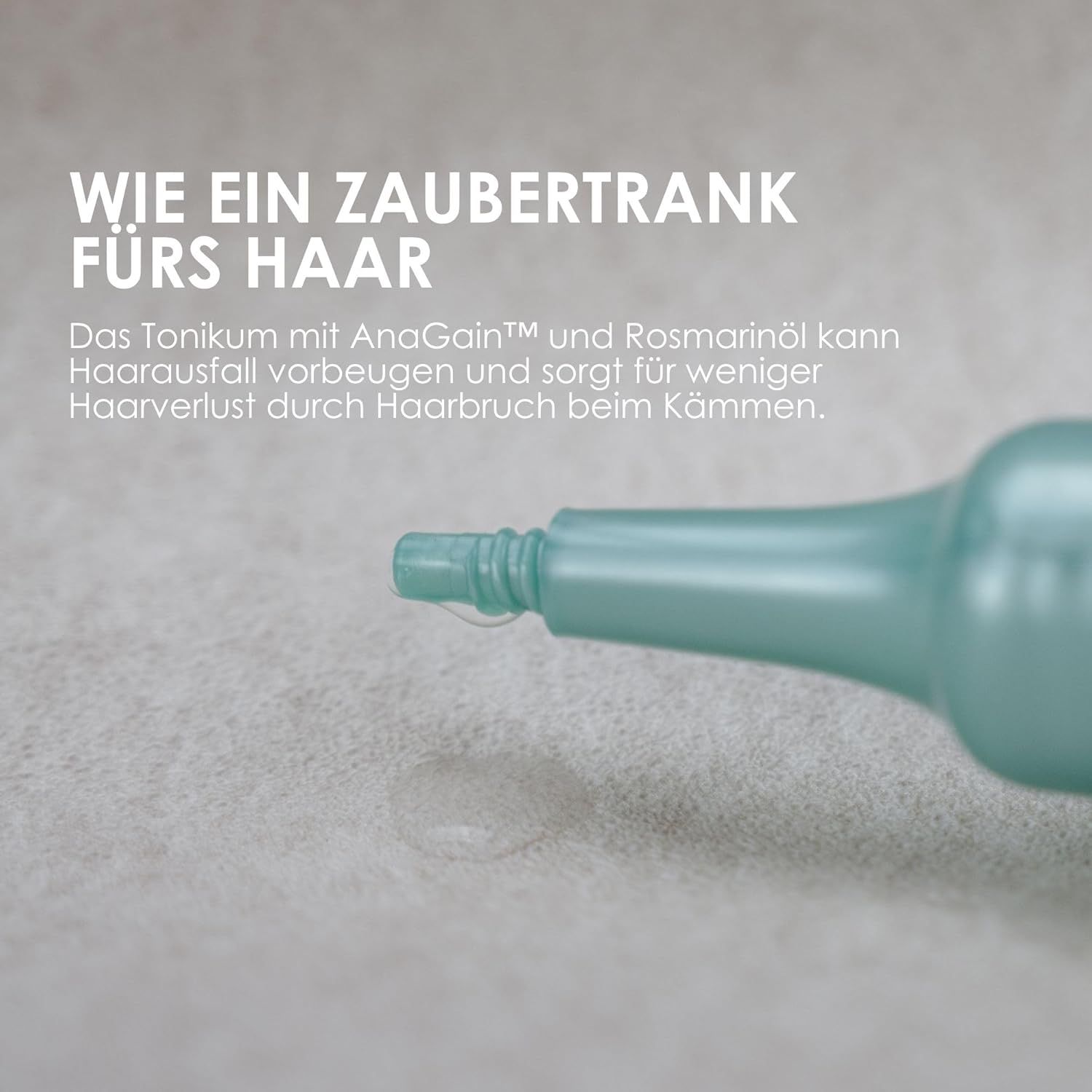 Nahaufnahme der Flaschenspitze mit Tropfen. Text: Wie ein Zaubertrank fürs Haar. Tonikum mit AnaGain und Rosmarinöl.