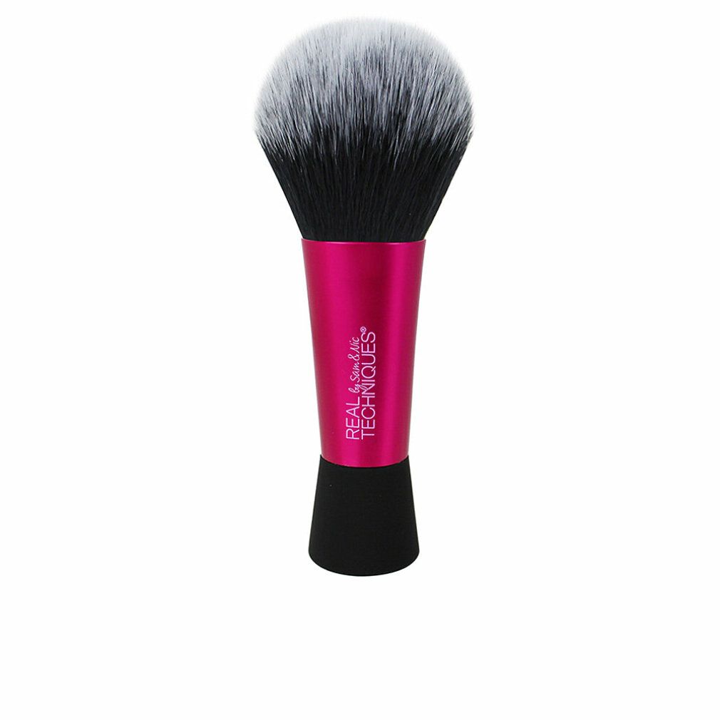 Puderpinsel mit pinkfarbenem Griff. Schwarze und weiße Borsten. "REAL TECHNIQUES" beschriftet.