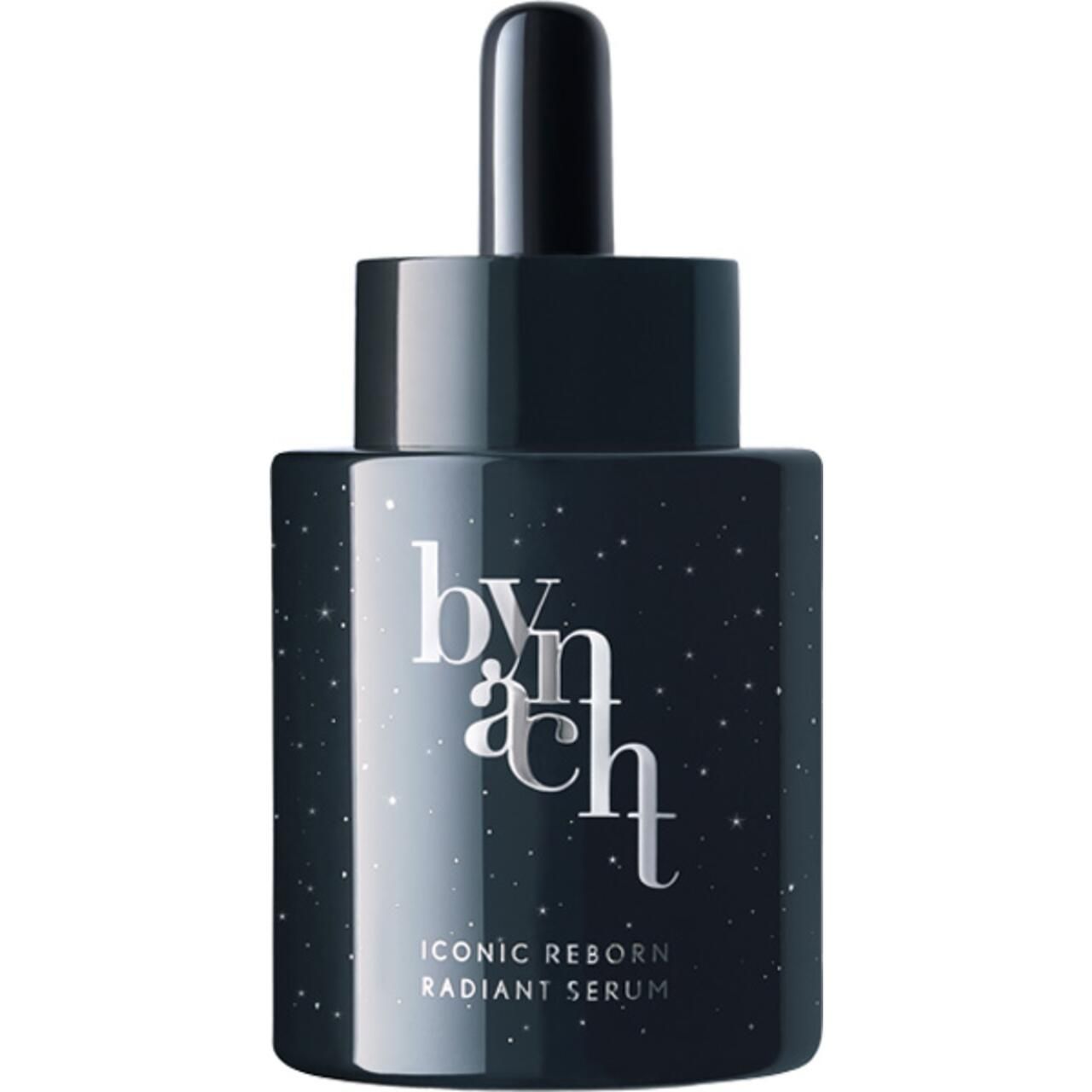 Dunkelblaue Serumflasche mit Pipette. Schriftzug 'bynacht' und 'ICONIC REBORN RADIANT SERUM'. Sterneffekt.