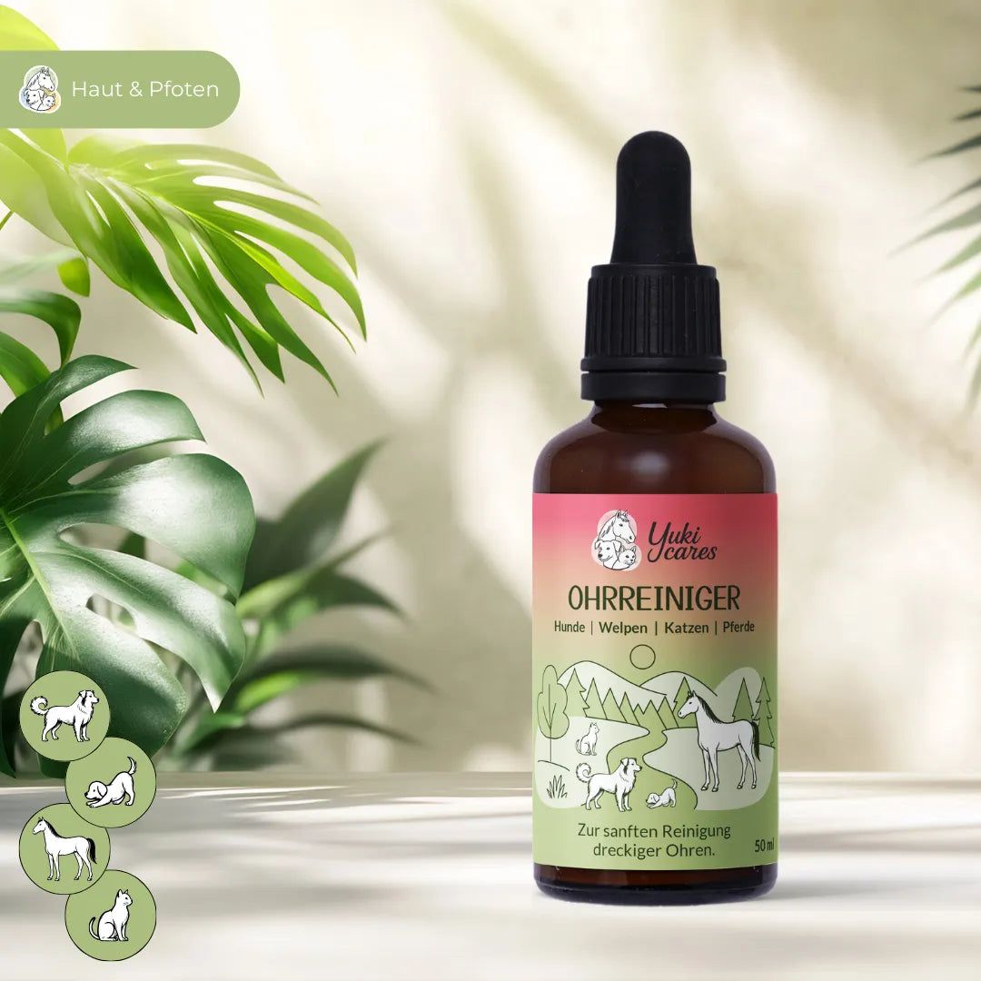 Braune Flasche mit Tropfer. Etikett mit Produktname, Marke Yuki cares und Illustrationen von Tieren. Hintergrund mit Blättern.