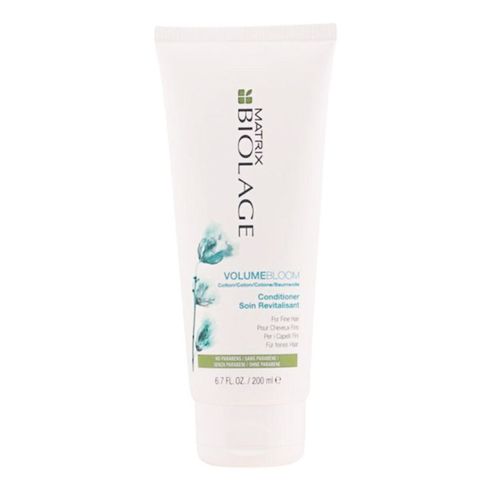 Weiße Tube mit grünem Etikett. Aufschrift BIOLAGE, VOLUMBLOOM, Conditioner. Für feines Haar. 6.7 fl.oz/200 ml.