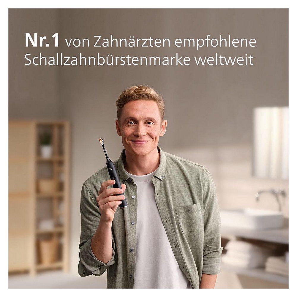 Mann hält schwarze elektrische Zahnbürste. Text: Nr. 1 von Zahnärzten empfohlene Schallzahnbürstenmarke weltweit.