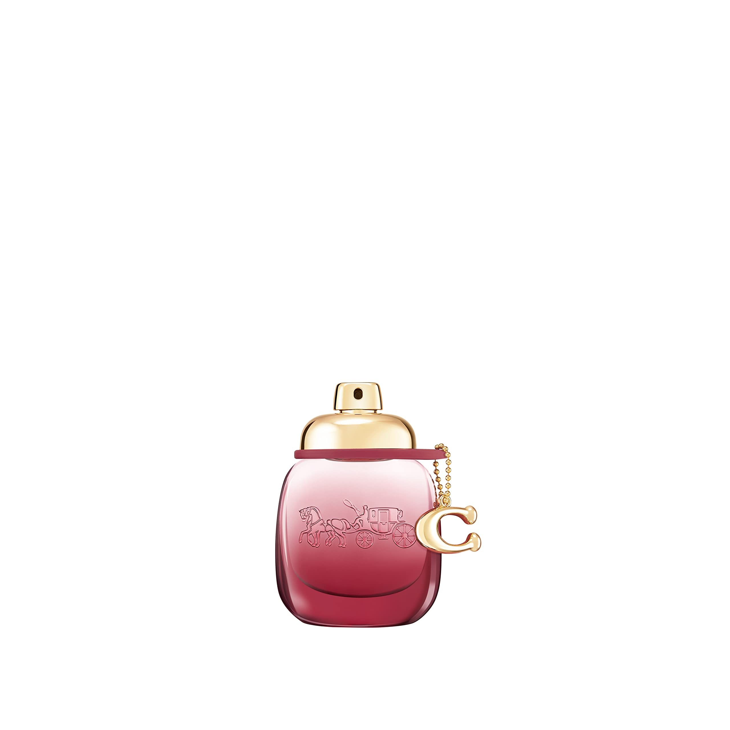 Coach Wild Rose EdP Nat. Spray. Rosa Flakon mit goldfarbenem Verschluss und Anhänger.