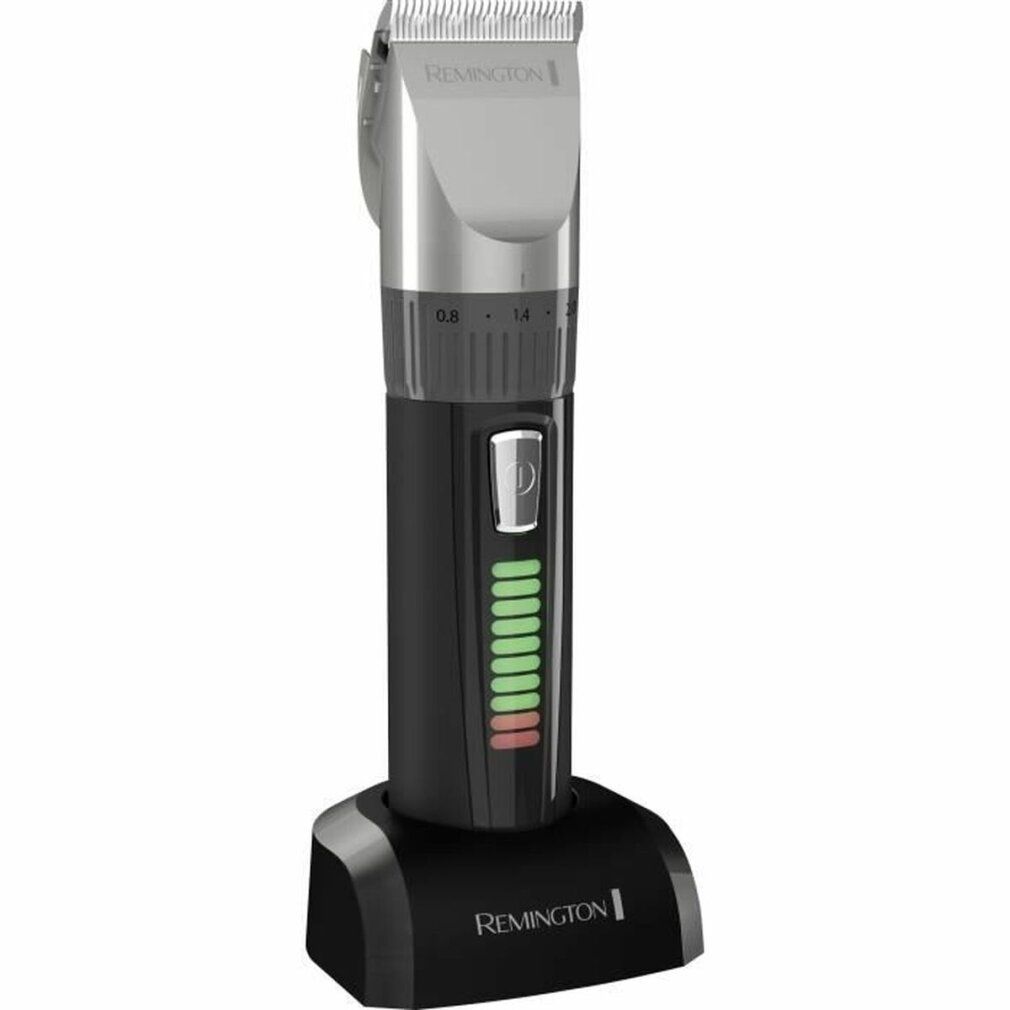 Schwarzer Haarschneider mit Ladestation. Akku-Anzeige mit grünen und roten Balken. Marke: Remington.