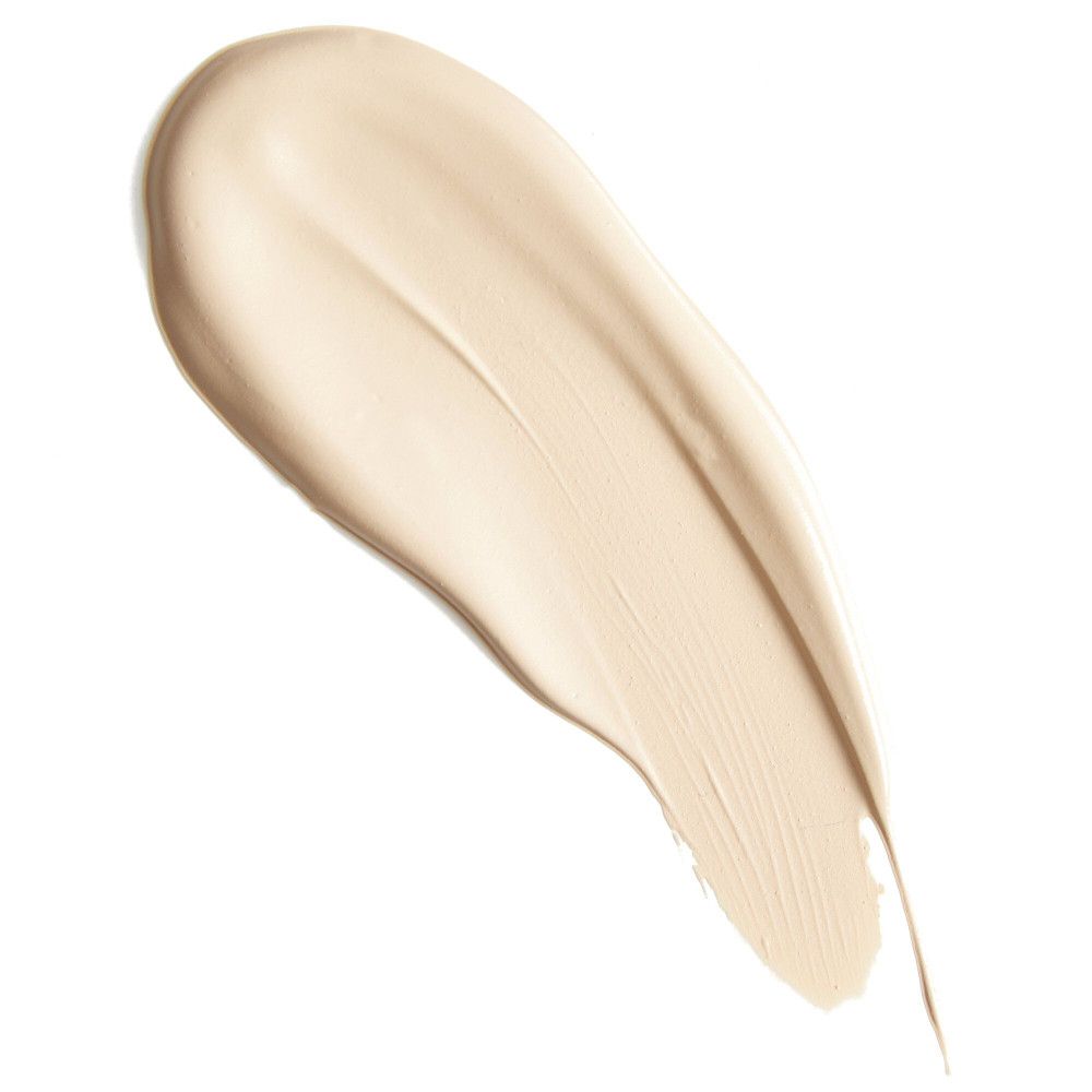 Heller Concealer-Abstrich auf weißem Hintergrund. Textur sichtbar.