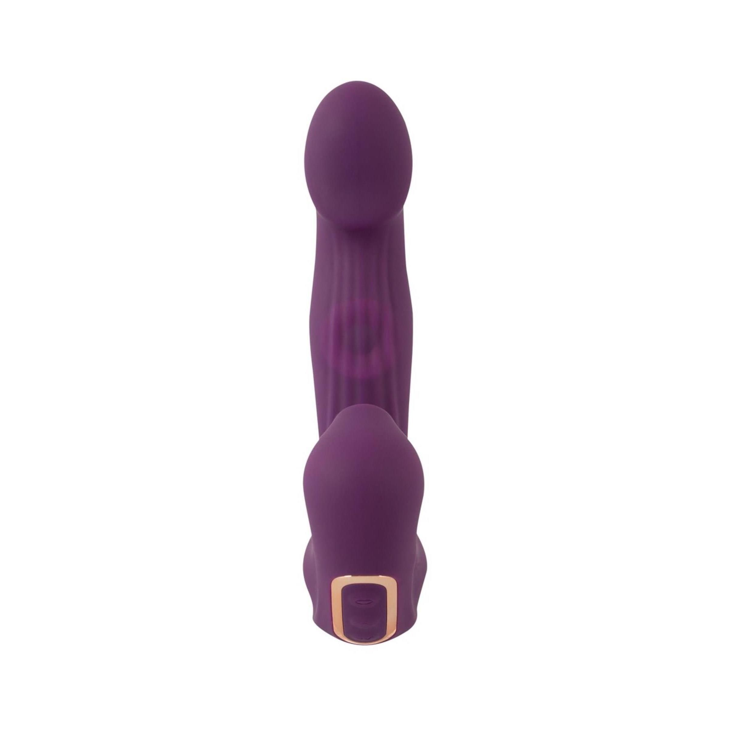 Lila Vibrator mit Klopffunktion und Klitorissauger. Zylindrische Form, glatte Oberfläche, mit Bedienfeld.