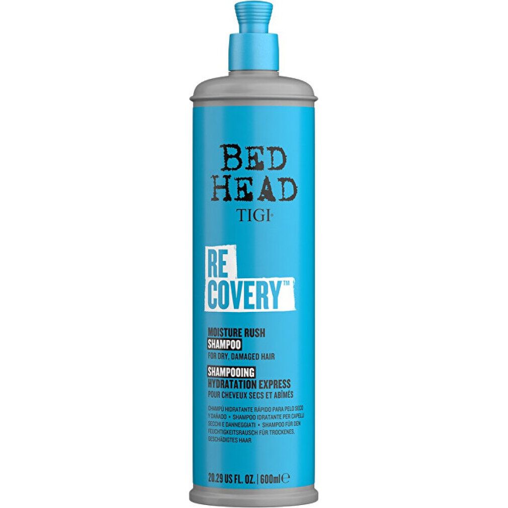 Hohe, türkisfarbene Shampoo-Flasche mit grauem Pumpkopf. Bed Head Tigi Recovery Shampoo, Text auf Etikett.