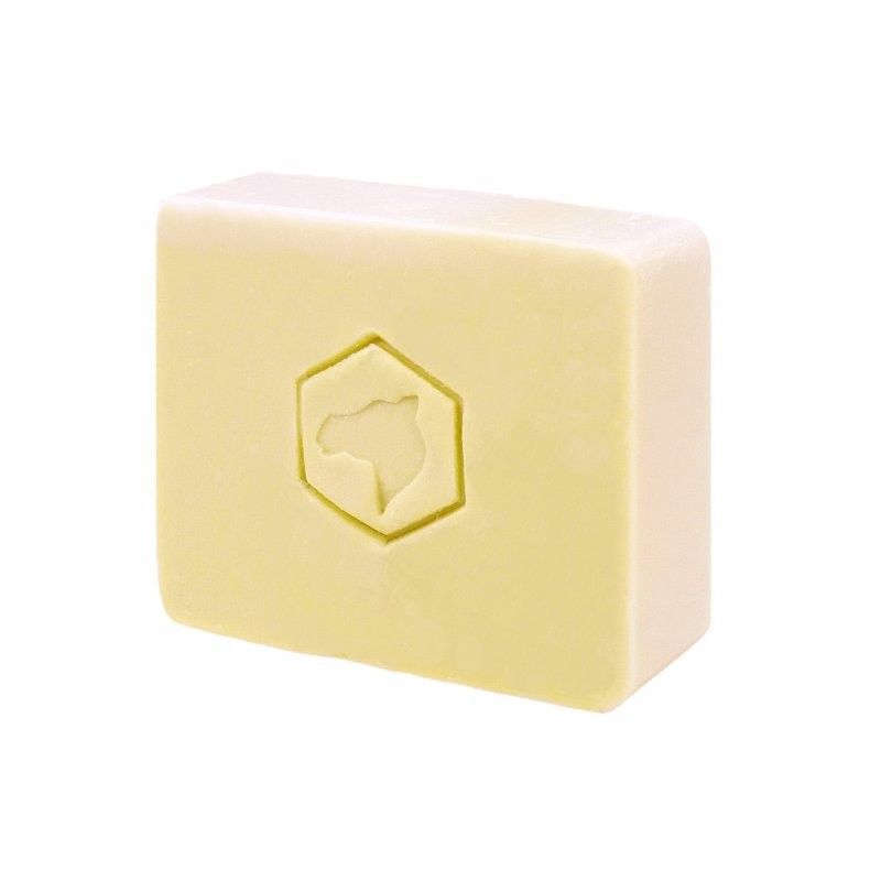 Sapone rettangolare giallo chiaro con logo cammello esagonale impresso.