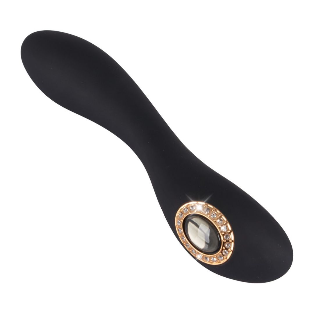 Schwarzer Vibrator. Ovales, goldfarbenes Detail mit Schmucksteinen. Ansicht von oben.