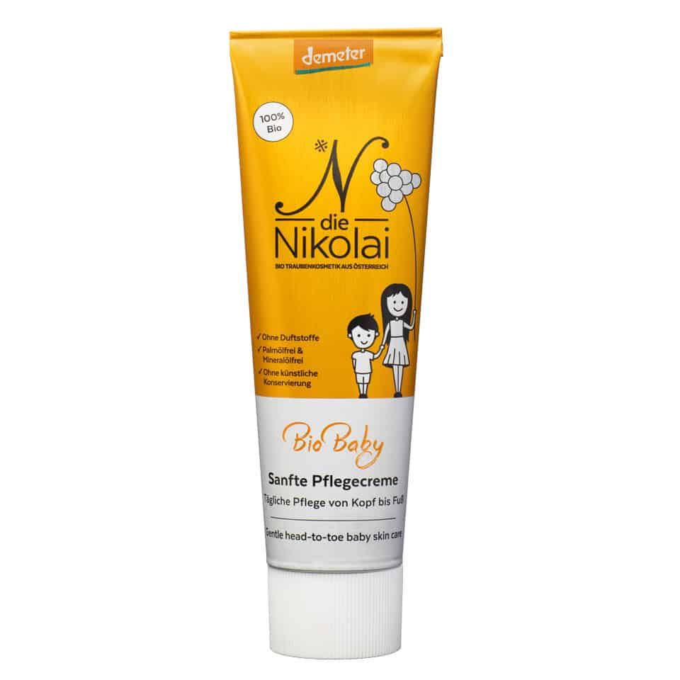 Gelbe Tube mit Aufdruck. Aufschrift: Bio Baby, Sanfte Pflegecreme. Demeter-Logo. Abbildung von Kind und Mutter.