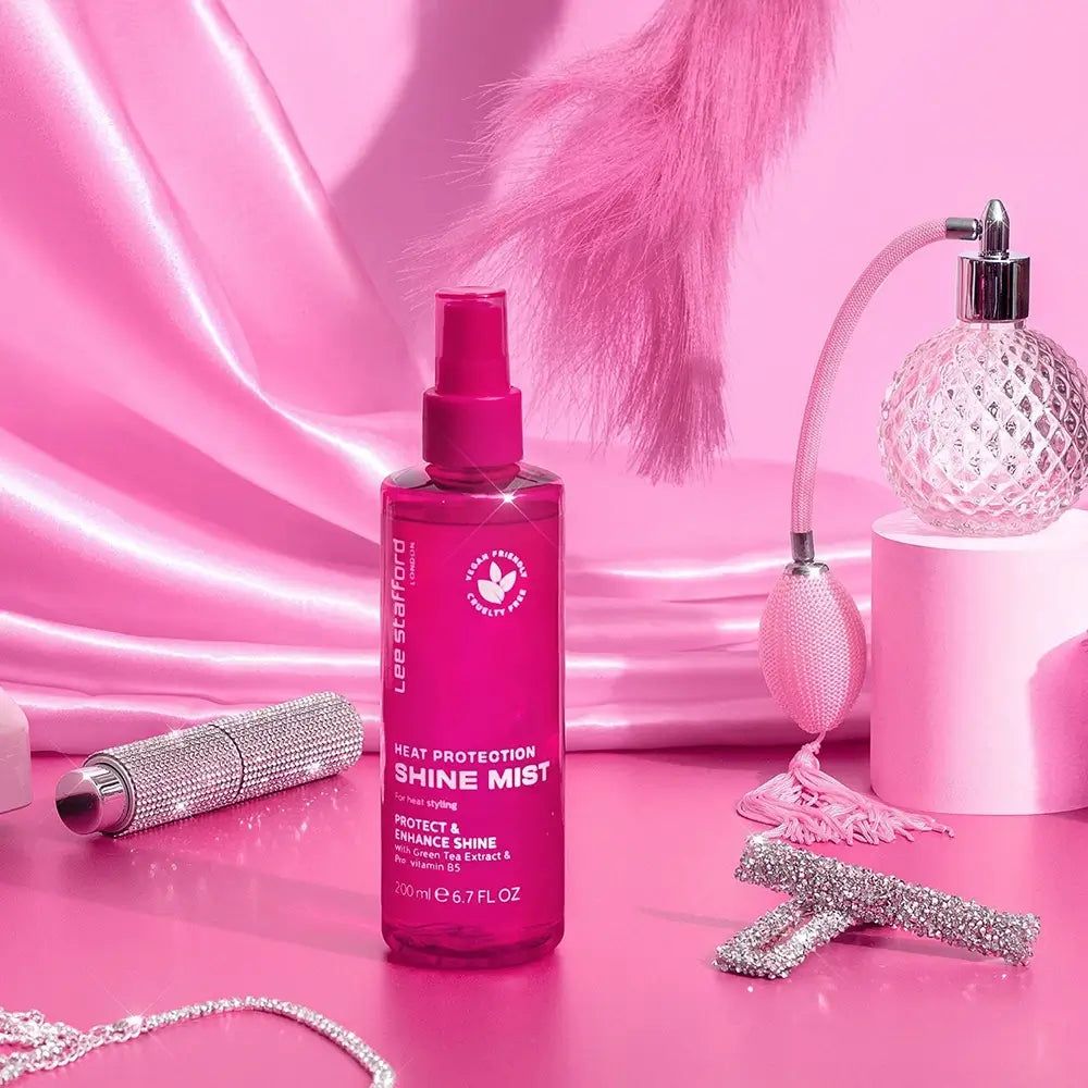 Fuchsiafarbene Flasche mit "Heat Protection Shine Mist" Aufschrift, 200ml.