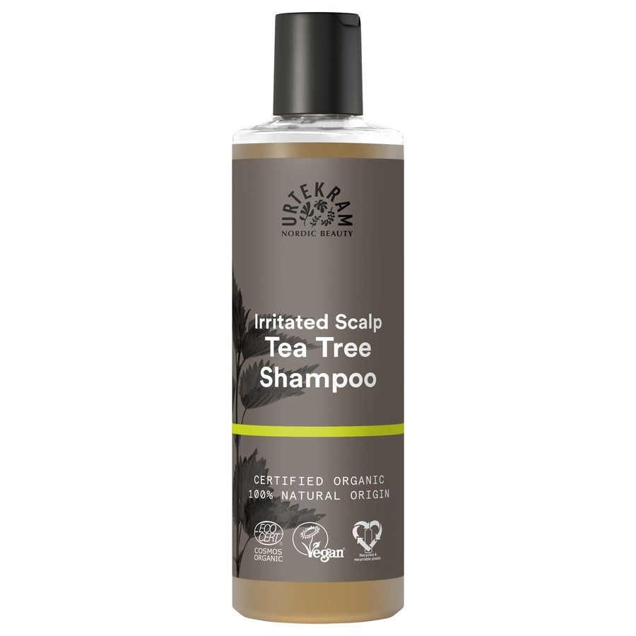 Shampoo-Flasche mit schwarzem Deckel. Aufschrift: Irritated Scalp Tea Tree Shampoo. Zertifiziertes Bio-Produkt.