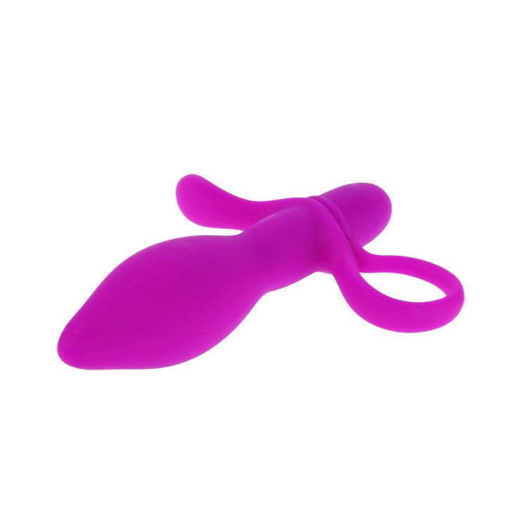 Lila Vibrator mit Ring und Flügeln. Auf weißem Hintergrund.