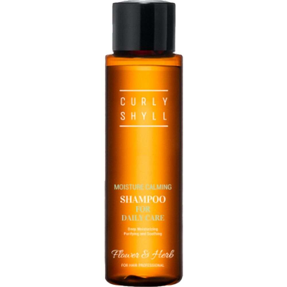 Braune Shampoo-Flasche mit schwarzem Deckel. Aufschrift: CURLY SHYLL, Moisture Calming Shampoo, Flower & Herb.
