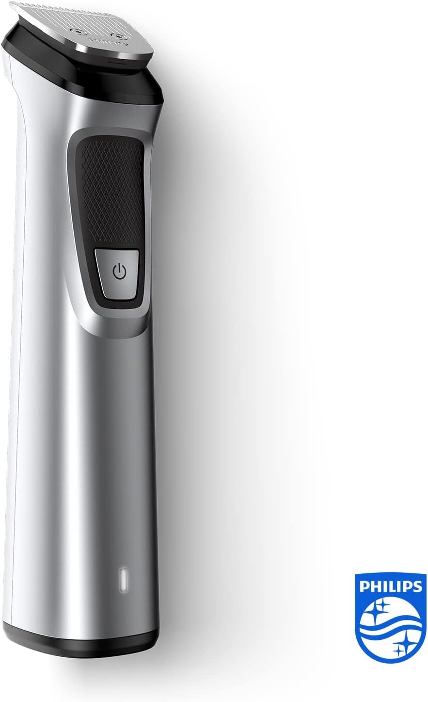 Silberfarbener Philips Multigroom Trimmer. Schwarzer Griffbereich mit Ein-/Ausschalter. Philips-Logo. Unterer Bereich mit Ladeanzeige.