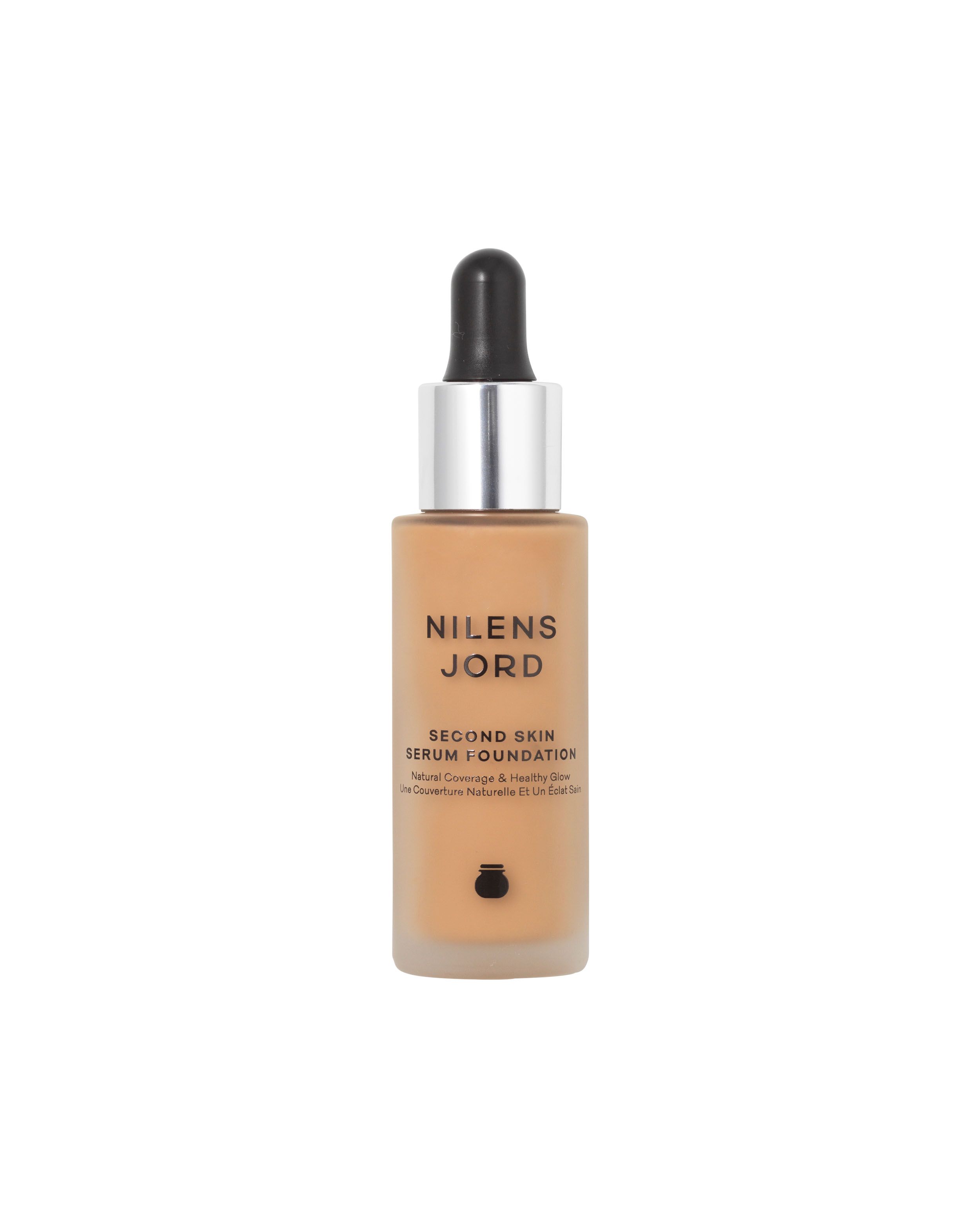 Nilens Jord Second Skin Serum Foundation in einem Glasfläschchen mit Pipette. Mittlere Deckkraft, gesunder Glanz.