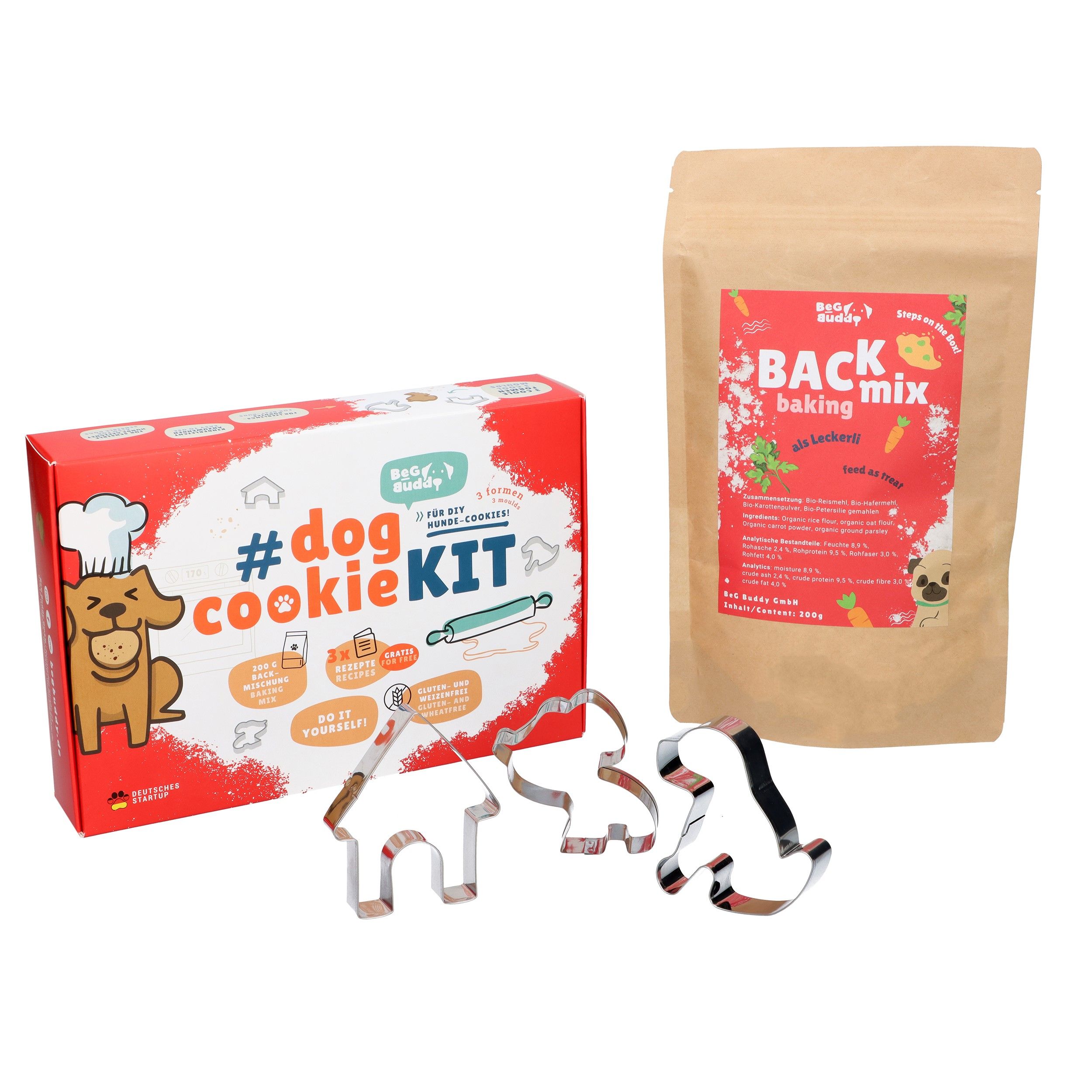 BeG Buddy Cookie Kit mit Backmischung und Ausstechformen. Braune Backmischung-Verpackung und drei Ausstecher.