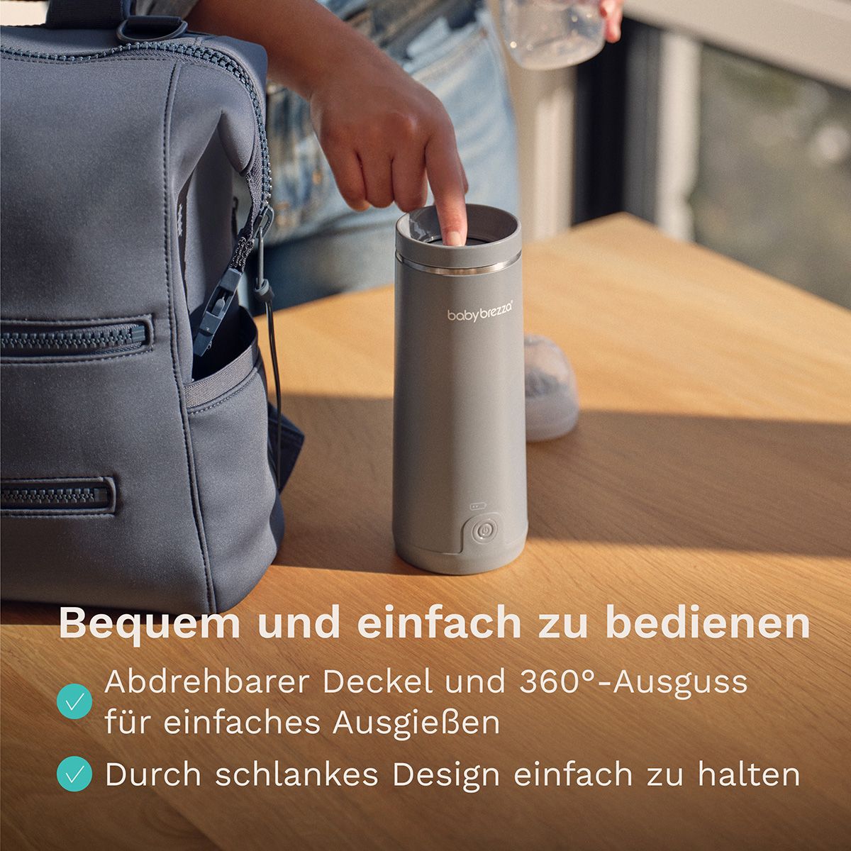 Silberner Tragbarer Muttermilch- & Wasserwärmer mit digitaler Anzeige und Bedienelement.