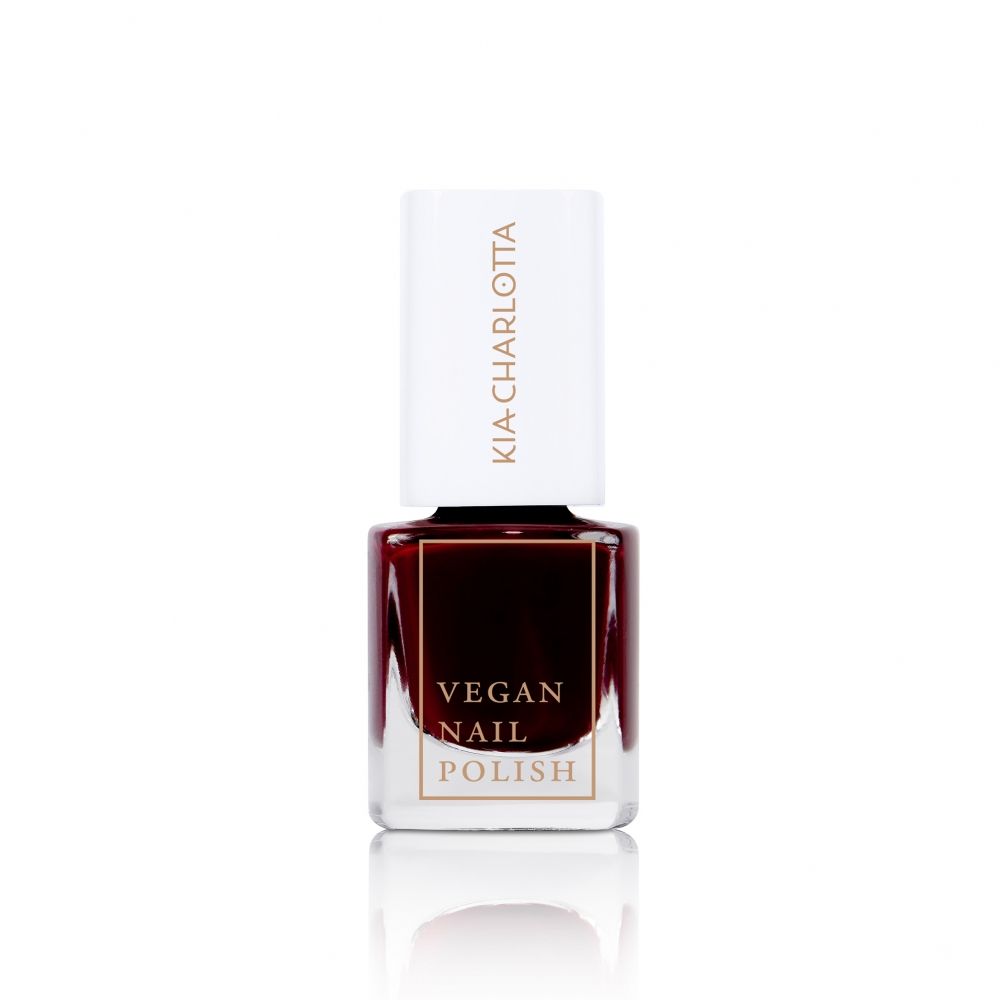 Nagellackflasche mit weißem Deckel. Auf dem Deckel steht KIA-CHARLOTTA. Auf dem Flaschenetikett steht VEGAN NAIL POLISH.