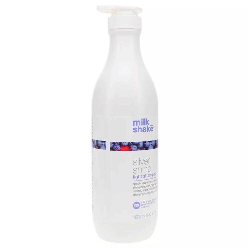 Weiße Flasche mit Pumpe. Aufschrift: milk_shake, Silver Shine Light Shampoo. 1000 ml.
