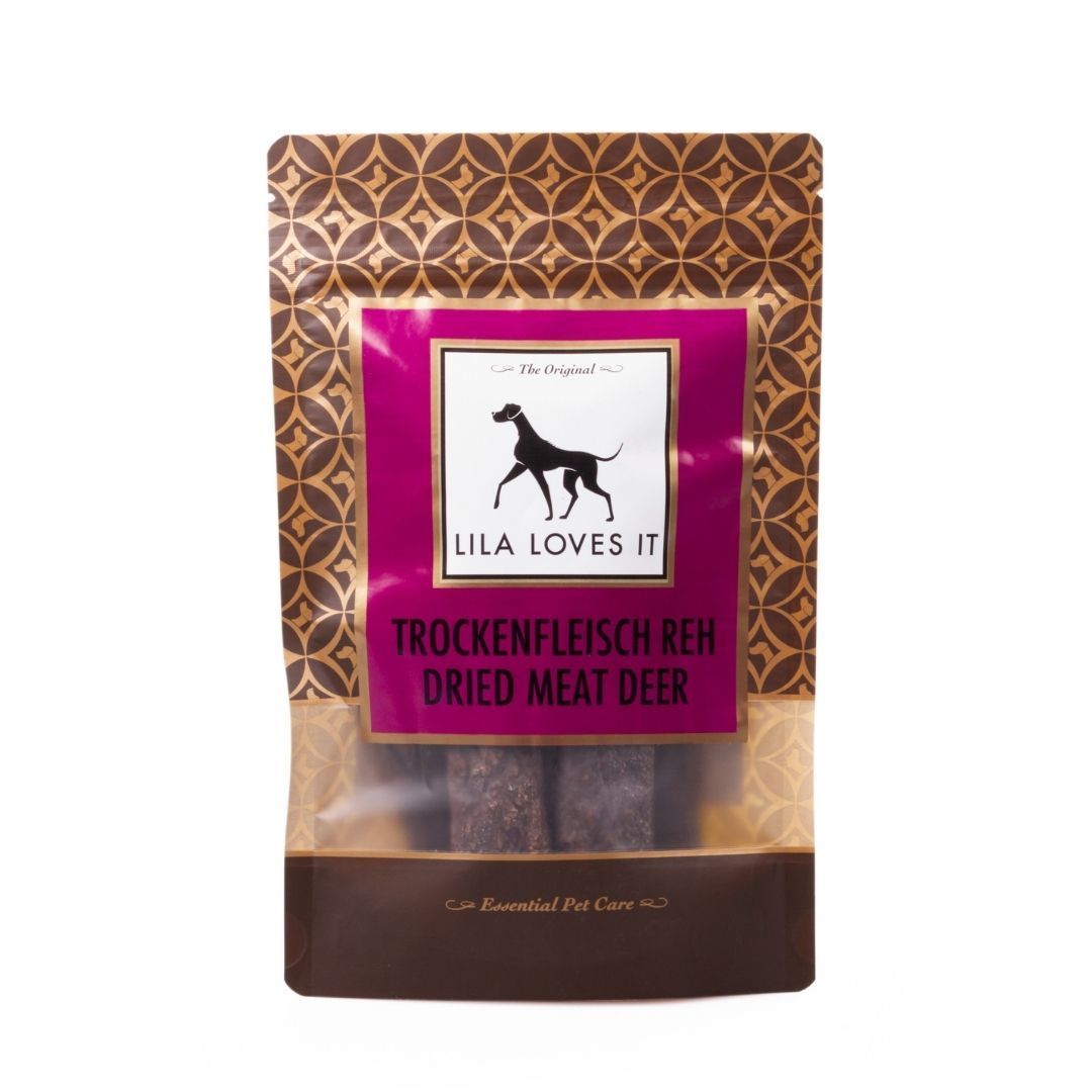 Verpackung mit Trockenfleisch Reh. Lila Loves It Logo und Produktbezeichnung. Sichtbares Trockenfleisch durch transparente Folie.