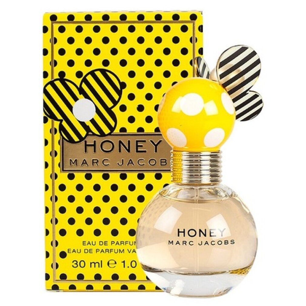 Parfümflakon und Verpackung. Gelbe Schachtel mit schwarzen Punkten. Flakon mit Schriftzug "Honey Marc Jacobs".