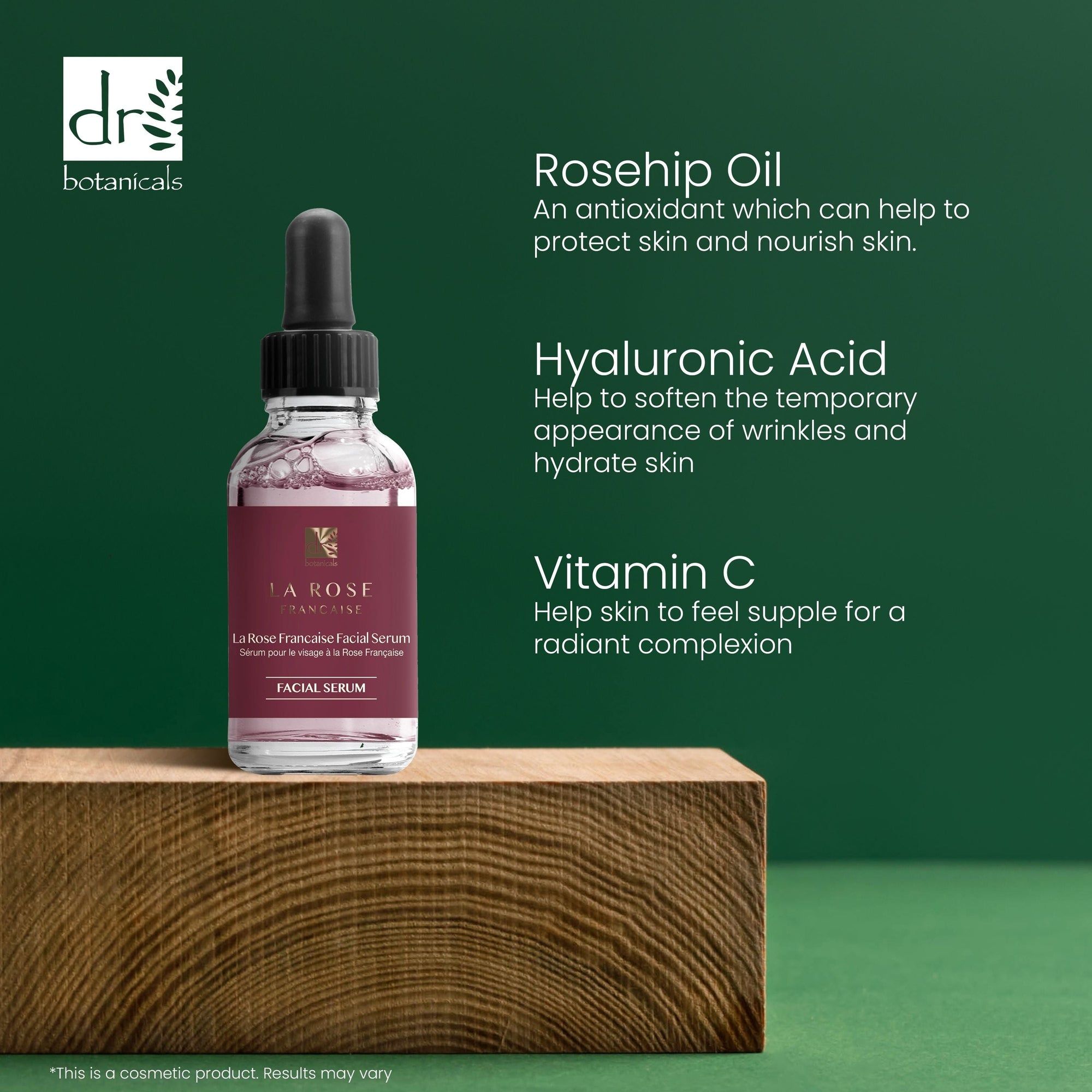 Produktflasche auf Holzblock. Text: Rosehip Oil, Hyaluronic Acid, Vitamin C. Logo: Dr Botanicals.