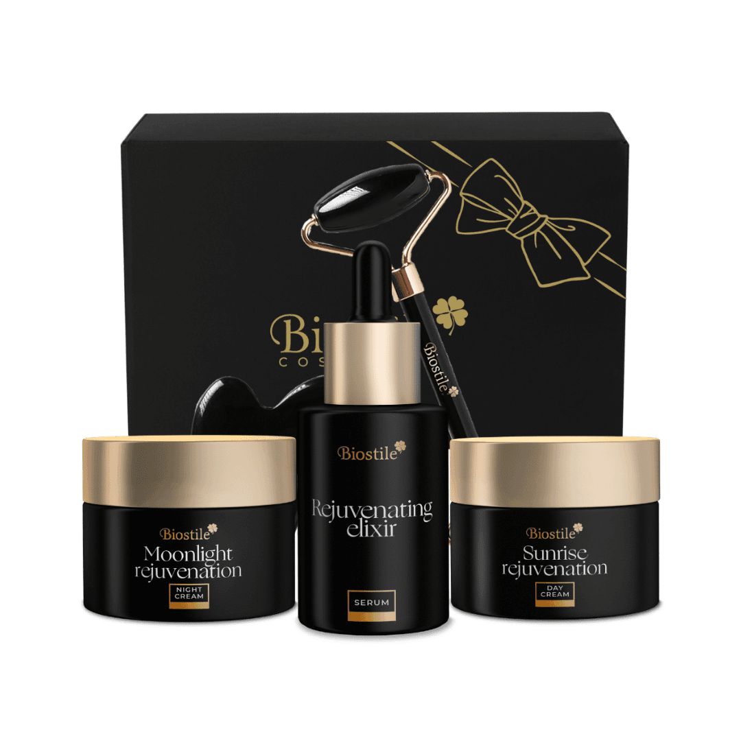 Set regalo con prodotti. Contiene crema, siero, rullo facciale e strumento Gua Sha. Confezione nera.