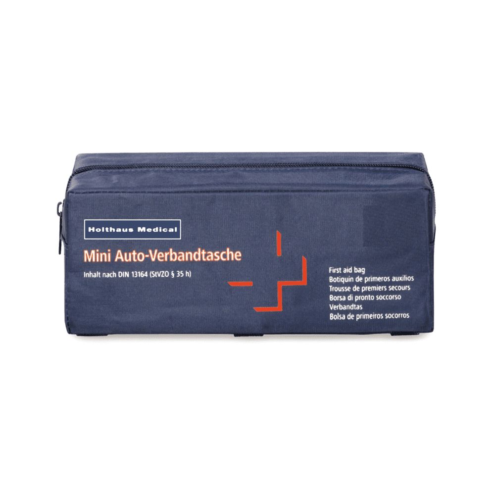 Dunkelblaue Mini Verbandtasche von Holthaus Medical mit rotem Kreuz-Symbol. Inhalt nach DIN 13164.