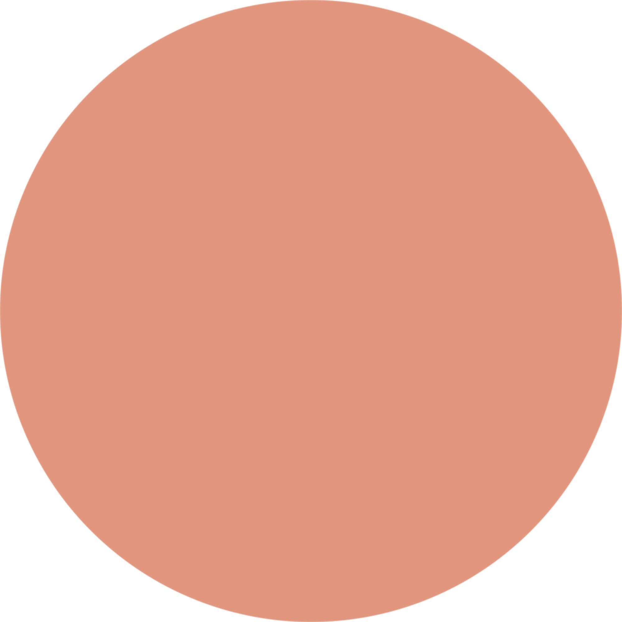 Kreisförmiger Farbklecks in Nude-Farbe.