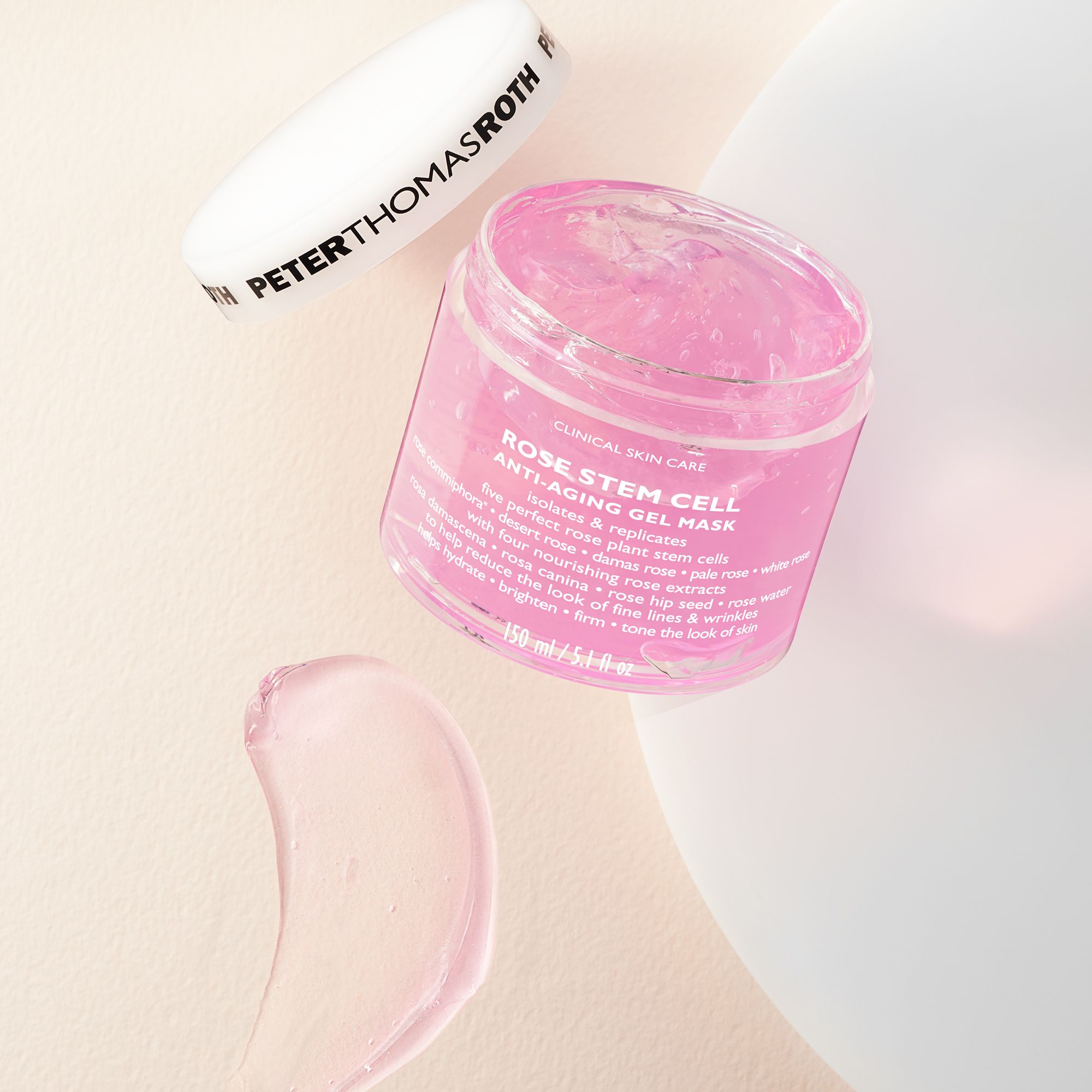Peter Thomas Roth Rose Stem Cell Anti-Aging Gel Mask, offener Behälter, rosa Gel. Deckel daneben. Produktetikett.