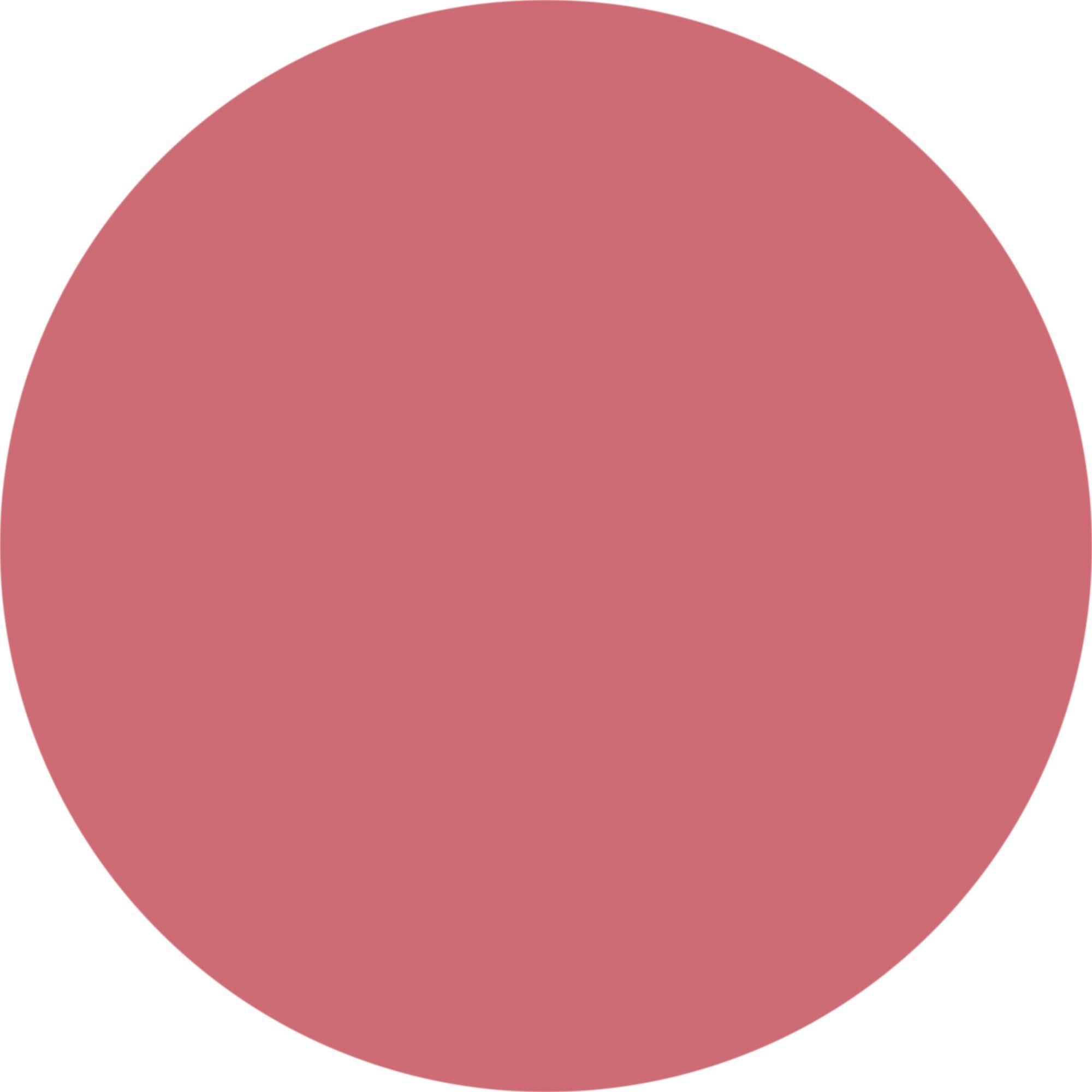 Ein kreisförmiger Swatch aus rosa Lippenstift auf weißem Hintergrund.