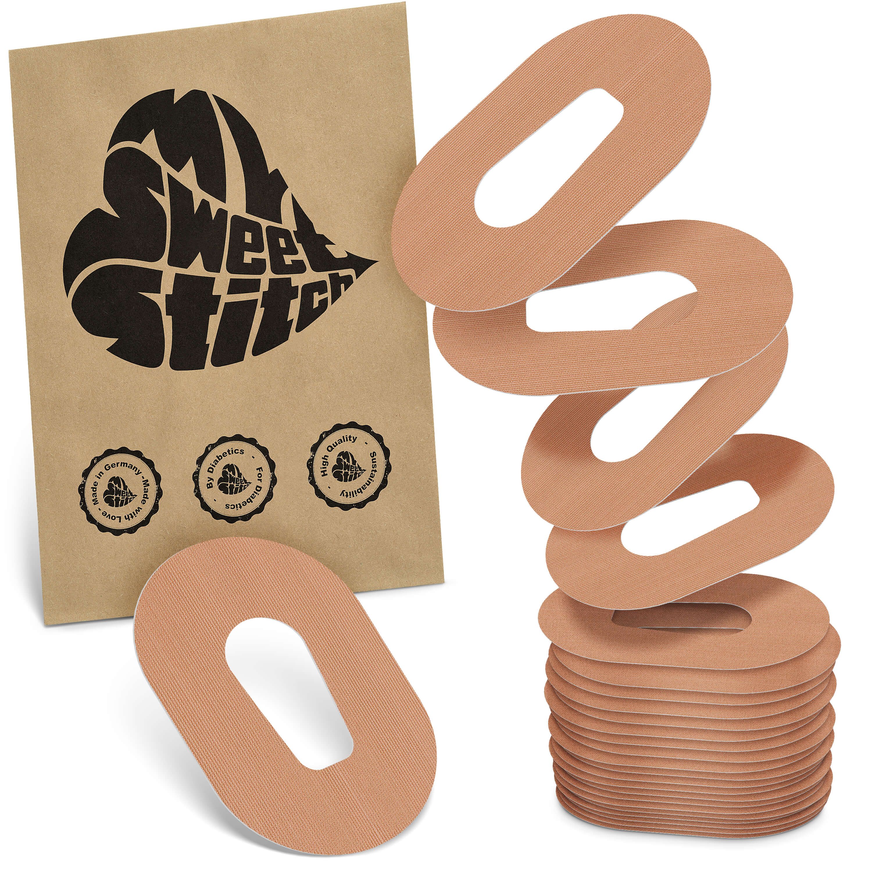 Fixierpflaster. Beige, ovales Pflaster mit zentralem Loch. Verpackung mit Logo und Qualitätssiegeln.